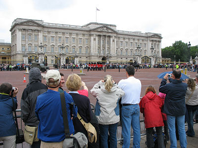 Thousands of onlooker watch the changing of the guard at Buckingham Palace