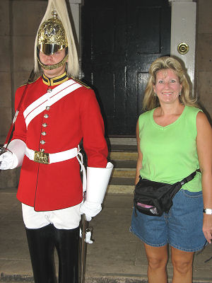 Susan standing next to one of the guards at the Horse Guards