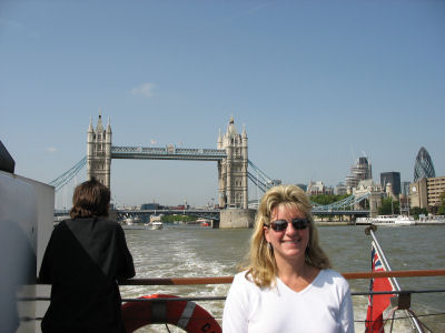 Susan on the back of the ship, with Tower Bridge in the background